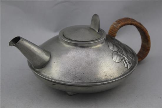 A Liberty Tudric pewter three piece tea set, no.0231, designed by Archibald Knox, teapot 9.75in.
